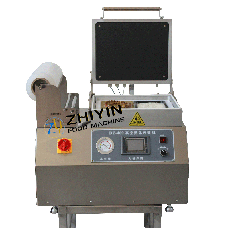 Automatic film cutting vacuum packaging and fitting vacuum packaging machine